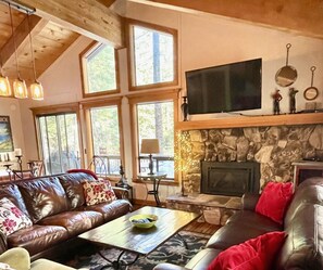 Living room with two leather sofas and lounge chair.