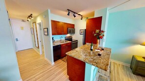 Fully stocked kitchen with full size fridge, range, microwave and dishwasher. 