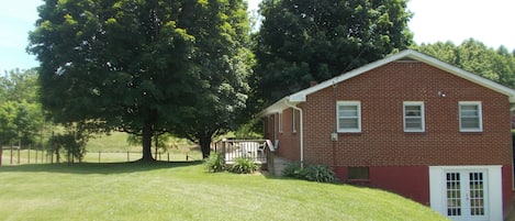  Large yard with back deck and plenty of shade trees. Grill on back deck. 