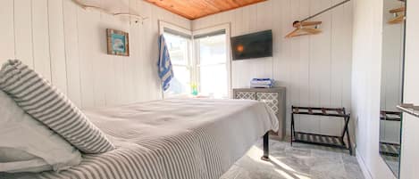 Master Bed of the Original 1950's cottages features the original knotty pine