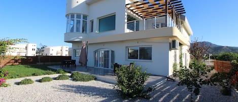 Back of house. showing garden and balcony from maser bedroom on first floor.