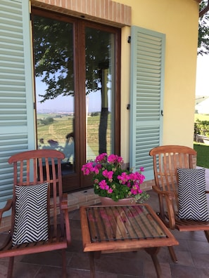 Teak steamer chairs on your private infinity edge terrace.