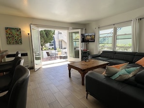 Family room Leather couch, looking out onto patio.