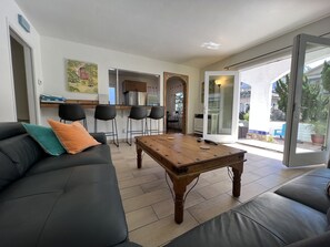 Family room Leather couch, looking out onto patio.