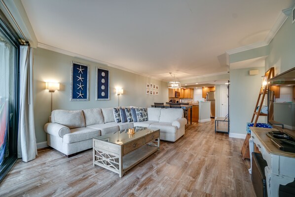 Spacious living room with sectional sleeper sofa.