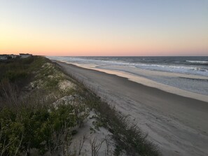Private beach access and pristine white sands await. Lifeguard stand.