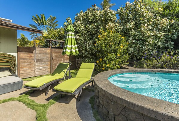 Backyard pool deck with chaise lounge seating