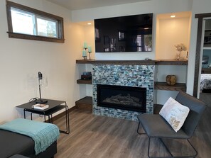Custom glass tile fireplace to cozy up to on cool beach nights!