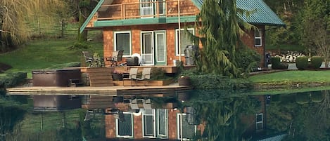 Reflection of the cabin in the pond.
