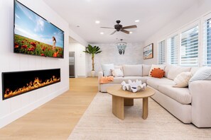 spacious living room with 65 inch  TV