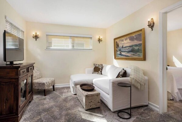 The living space offers a HD TV and cozy couch for lounging.