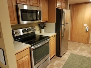 Kitchen view with brand new stainless steel appliances (installed 12/17).