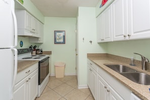 Kitchen with pass through to living room area.  