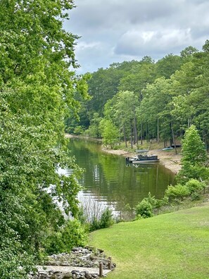 Boats and barges can be docked in the cove below the condo
