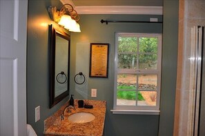 Hall bath and master bath have granite counters.