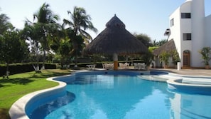 Villa te Quiero pool, large palapa shade, restrooms, sunchairs and loungers.