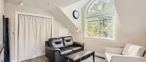 Cozy second story living room. South facing window collects morning sunlight.