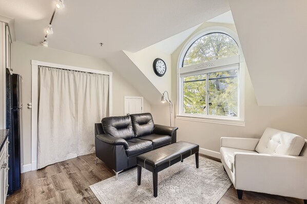 Cozy second story living room. South facing window collects morning sunlight.