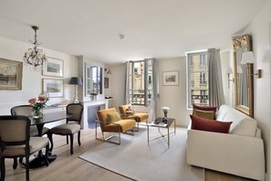 Beautiful large windows overlook charming Place Dauphine!