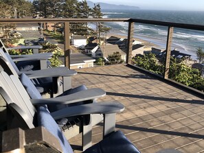 Unobstructed view from tree deck with four very comfortable Adirondack chairs