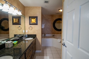 Master bath with twin vanity, soaking tub and shower.  

