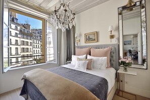 Wake up to the pretty views of Place Dauphine from the bedroom window.