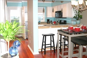 LIVING ROOM, DINING ROOM AND VIEW INTO THE KITCHEN