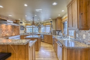 Massive kitchen with wraparound seating is perfect for large groups. The chef in your group will love the 2 dishwashers, double oven and four fridge drawers. No chef in your group? There are many for hire that are familiar the property. Ask us about it!
