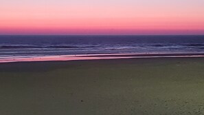 This shows the long flat sandy beach.  