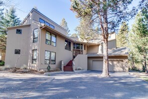 Front entry, large driveway for up to 6 cars. Basketball hoop to left.