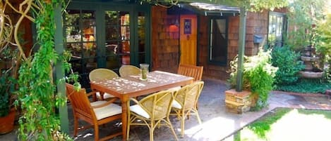 Front Courtyard with grassy area, flowers and fountain. Private. 