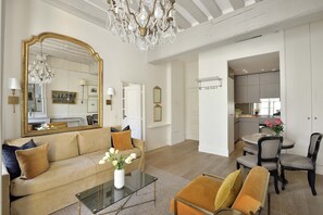 Open plan living area with dining area and fully equipped kitchen.