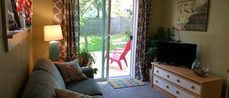 Comfortable living room with plenty of natural light. 