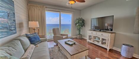 Living area overlooking the Gulf with new sofa and two recliners!