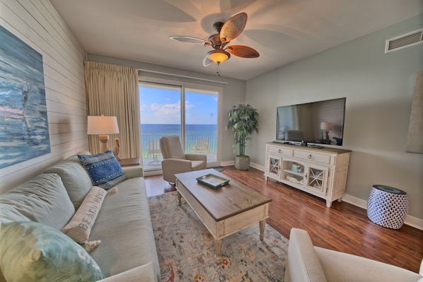 Living area overlooking the Gulf with new sofa and two recliners!