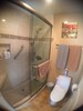  tiled shower and toilet area 

 