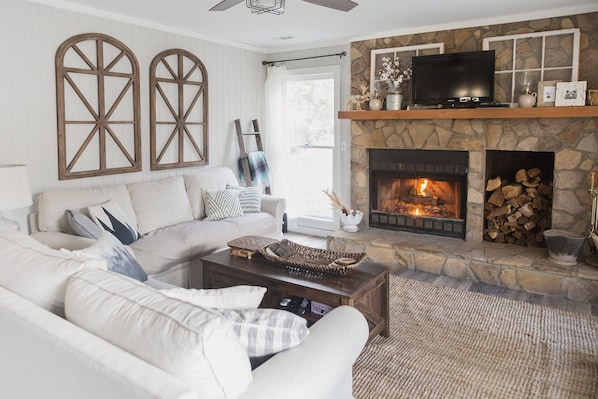 Cozy living room for relaxing by the fireplace or watching a movie