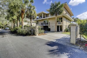 Street view.  Circular drive with gate enclosure.