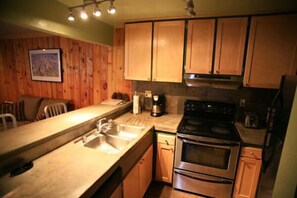 Updated kitchen with rustic concrete counter tops. All new appliances.