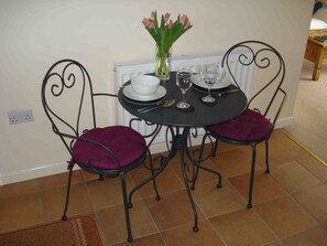 Table and chairs in kitchen for breakfast and snacks