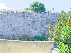 the view from bedroom window to the medieval city wall