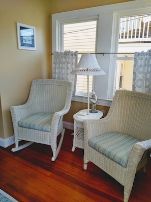 as you walk in you are greeted by a comfy sunroom area