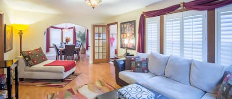 Living room with beautiful Plantation shutters and large comfortable seating