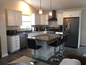 Fully stocked modern kitchen with island 