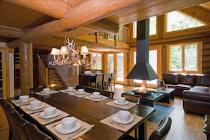 Dining area with 4-sided glass fireplace, living area. Spectacular views!