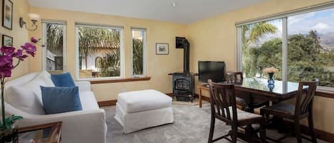 The bright living room is highlighted by picturesque mountain and City sky line views.