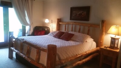 King Master Suite with velvet comforter cover, King lace drapes/ door to hot tub