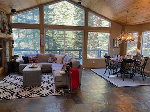 Bright family room with  forest views