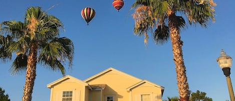 Palm trees, morning moon and hot air balloons at 5 Star Orlando