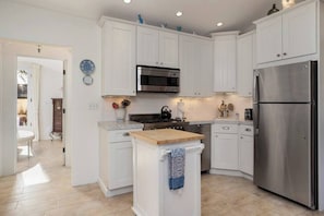 The kitchen features culinary essentials and thoughtful, high-end touches.